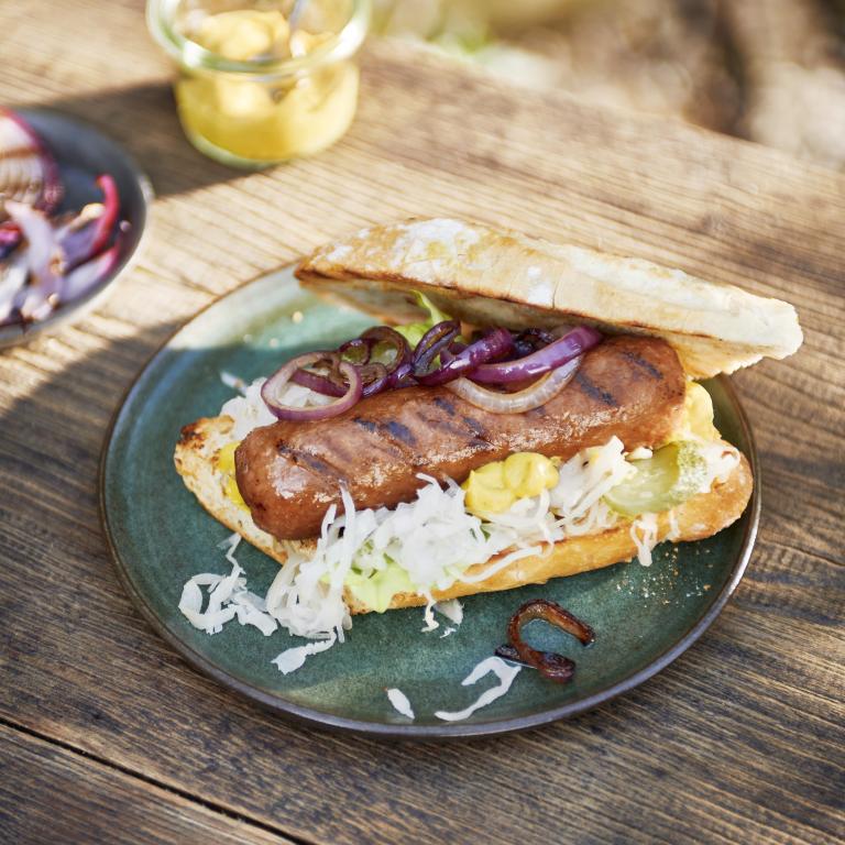 Sensational hot dog with sauerkraut, pickle and fried onion